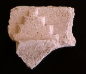 Sir Bani Yas - Step decoration on plaster fragment from the monastery (site SBY9)  (Photograph by Dr Mark Beech)